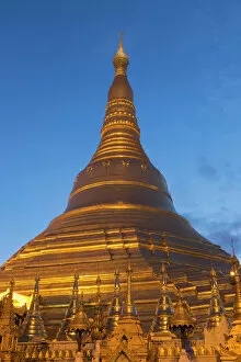 Pagoda Gallery: Myanmar, Yangon. A golden stupa at Shwedagon Pagodo, at twilight