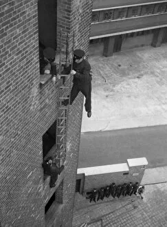 Tower Collection: Firefighter during hook ladder practice