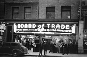 Entertainment Gallery: Men standing in front of the Board of Trade bar and gambling house in Butte, Montana
