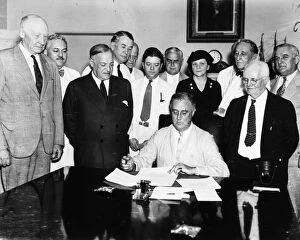 Seated Gallery: President Franklin D. Roosevelt signing the Social Security Act in the Cabinet Room of the White