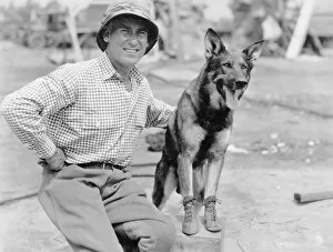 Seated Collection: RIN-TIN-TIN (1916-1932). American canine actor. With his owner, Lee Duncan