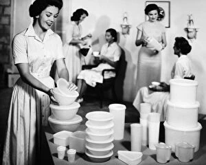 Fashion Gallery: TUPPERWARE PARTY, 1950s. A Tupperware party in an American home. Advertising photograph, 1950