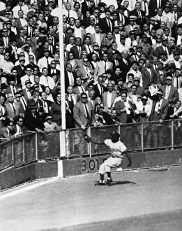 Crowd Collection: WORLD SERIES, 1955. Left fielder Sandy Amoros of the Brooklyn Dodgers catches a deep fly ball hit