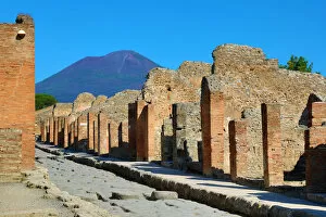 Street and ruins of houses in the ancient Roman city of Pompeii, Italy