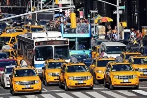Yellow taxi cabs driving in the street, New York. America