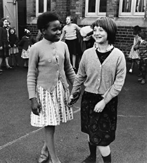 Two girls in a school playground, Birmingham