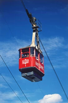 Tourist Attractions Collection: Canada, Alberta, Jasper National Park, red cable car photographed against deep blue sky