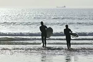 Woolacombe Collection: Great Britain, England, Devon, Woolacombe, Woolacombe Bay, two surfers entering the sea