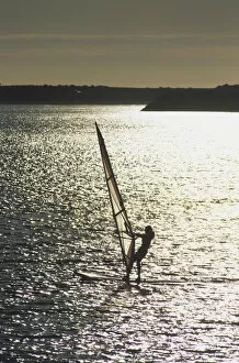 Tourist Attractions Collection: Portugal, Viana do Castelo, man windsurfing at sunset, high angle view