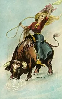 Adults Collection: Postcard of a Woman Riding a Bull. ca. 1913, Postcard of a Woman Riding a Bull