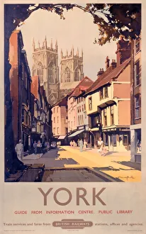 <b class=qtipBold><figcaption>'York', BR poster, 1950s</figcaption></b><br>Poster produced for British Railways (BR) to promote rail travel to the city of York, Yorkshire. The poster shows a street lined with shops and houses with York Minster visible in the background. Artwork by Claude Buckle (1905-1973), who originally trained as an architect, but later turned to pictorial art. He painted in both oil and watercolour and was a prolific poster artist for Great Western Railway (GWR) and BR. Much of his original poster artwork is held at the National Railway Museum.<br><em>© Please read our licence terms. All digital images must be destroyed unless otherwise agreed in writing.</em> 'York', BR poster, 1950s
