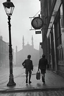 Walking Collection: Gorbals area of Glasgow; Two young boys walking along a street in 1948