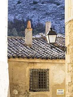 Narrow street with snow covered roof in the city of Cuenca