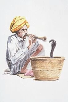 Tourist Attractions Gallery: Snake charmer playing flute-like instrument, snake emerging from basket in front