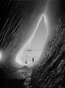 Grotto in an iceberg. Terra Nova in the distance. Taylor and Wright (Interior). January 5th 1911 Grotto in an iceberg. Terra Nova in the distance. Taylor and Wright (Interior). January 5th 1911