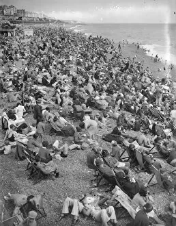 Adults Collection: Holidaymakers on Brighton beach. 5th August 1936