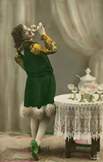 Enjoying Collection: Pretty girl enjoying a glass of wine punch (colour litho)