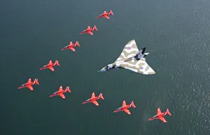 <b class=qtipBold><figcaption>Red Arrows Farewell to Vulcan</figcaption></b><br>The Red Arrows have flown with the Vulcan bomber for the final time in a show of great British aviation icons. Jets from the Royal Air Force Aerobatic Team performed a flypast with the mighty Cold War aircraft at the Southport Air Show this afternoon (Saturday, September 19th, 2015). Thousands of people cheered and waved as the Red Arrows' nine distinctive British-built Hawk aircraft made a V-shape in front of the Vulcan. Red Arrows Farewell to Vulcan