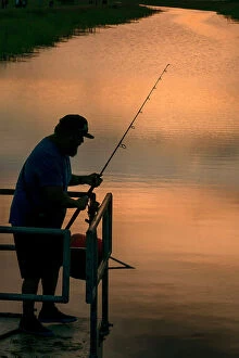 Enjoying Collection: Florida, Everglades, man fishing in canal